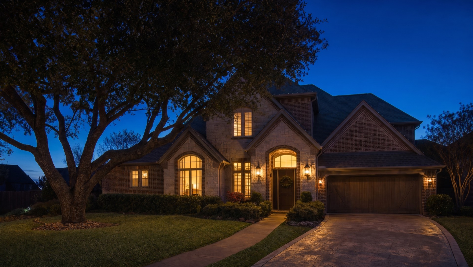 Two-story brick home at dusk with no Christmas lights
